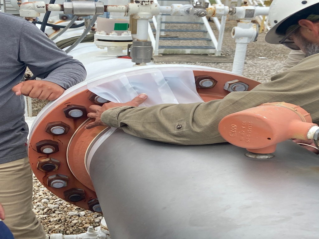 Application of ZERUST® corrosion protection products - including ZIF Tape, ICT® Tube Strip Pro, and ZIF Guard - on a newly installed 24-inch pipe section in Texas, USA. 1